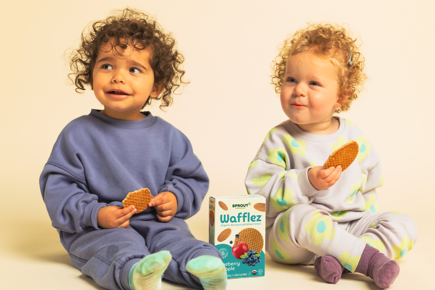 two children sitting eating sprout organics wafflez